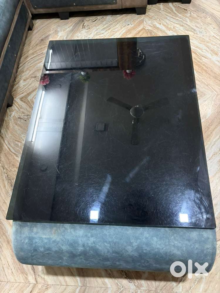 Black glass top with blue grey velvet fabric centre Table