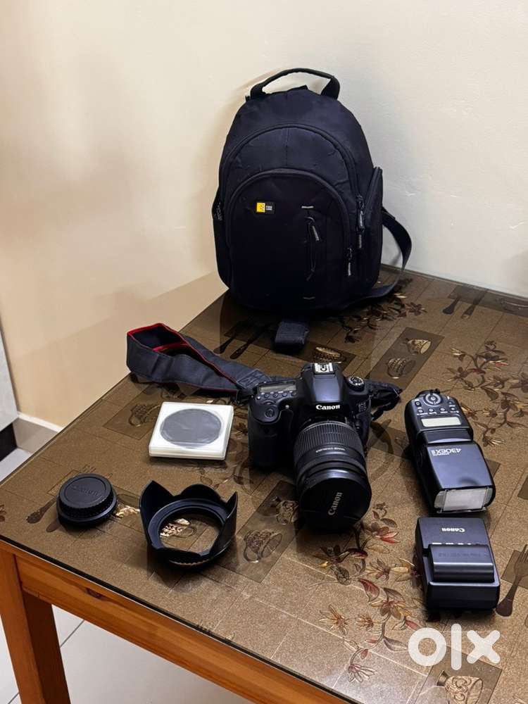 Cannon EOS 60D with 18-200 mm lense, bag, flash, cleaning kit