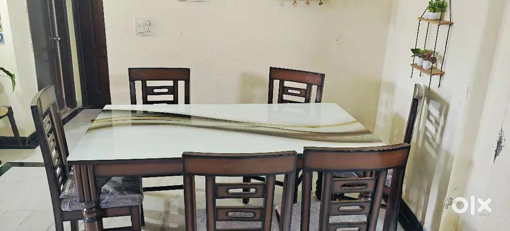 Pure wood dining table.pure sangwan wood with glass top and brand new