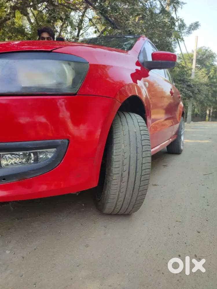 It's A Red Colour Polo With 17 Inchi Alloys