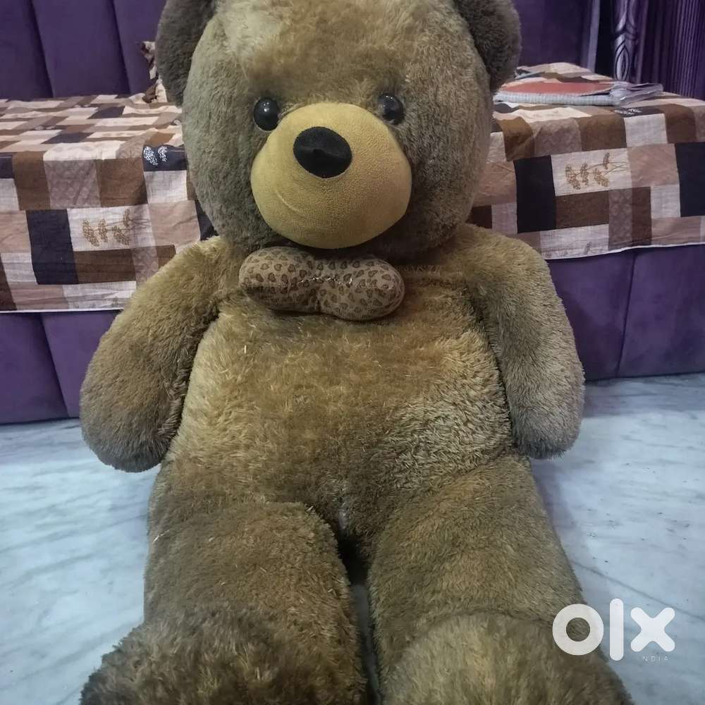 large, brown plush teddy bear.