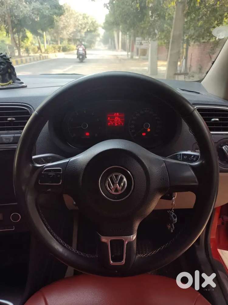 It's A Red Colour Polo With 17 Inchi Alloys