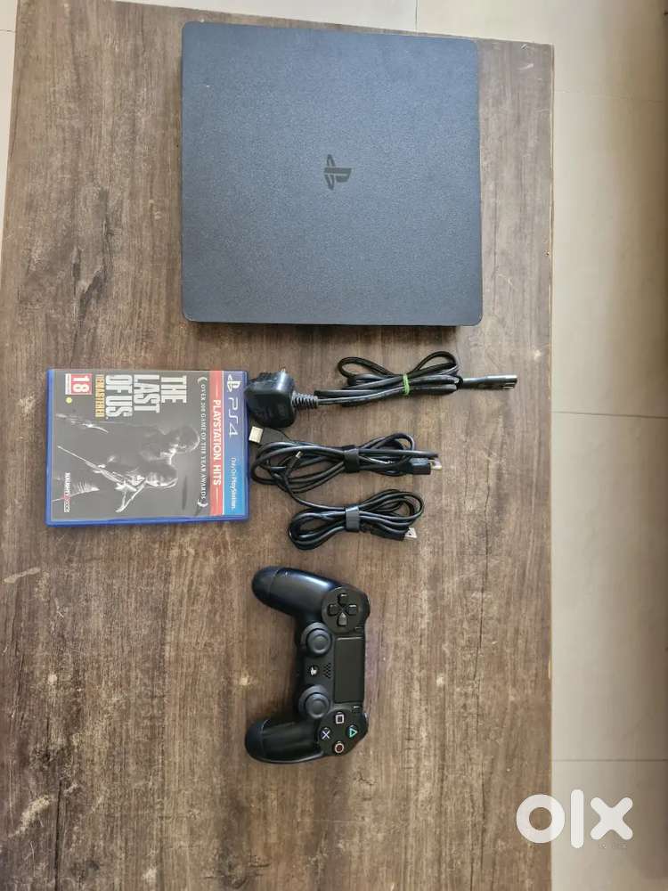 Sony PlayStation 4 Slim (Black) with DualShock 4 Controller & The Last