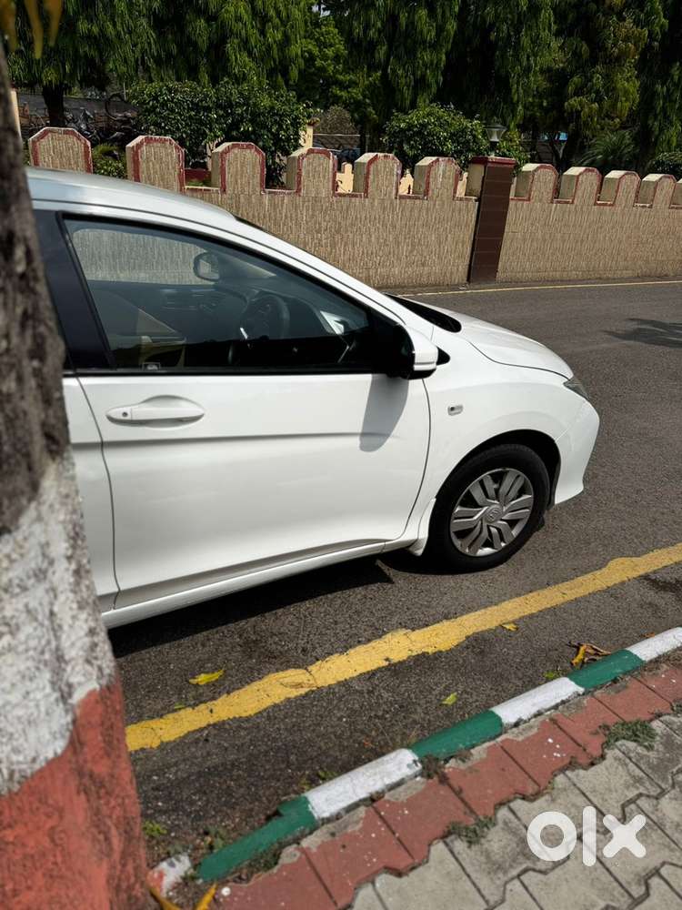 White Honda City - Officer Driven