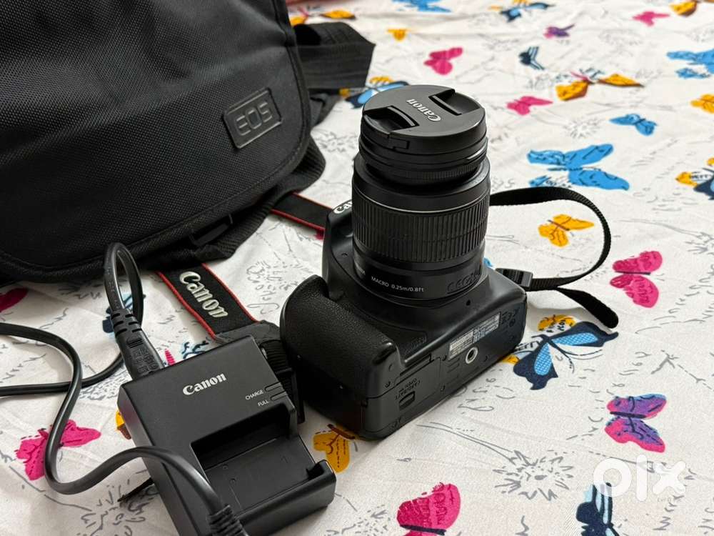 Cannon 1300d with carger and bag