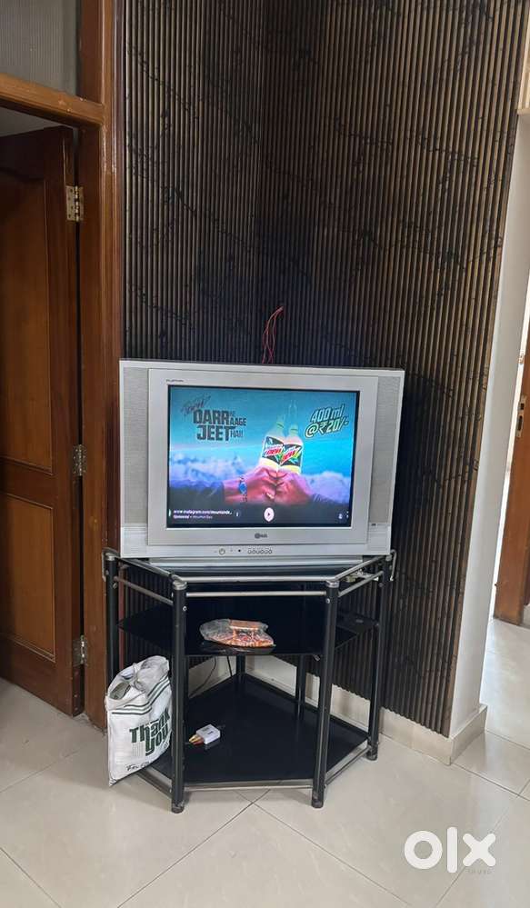 LG TV WITH GLASS TROLLEY