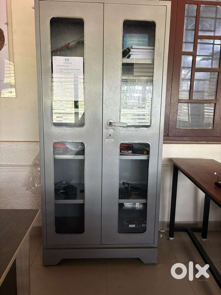 Heavy duty steel almirah with glass window, solid steel & office table