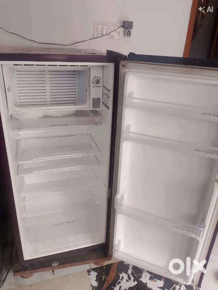 Maroon Whirlpool single-door refrigerator