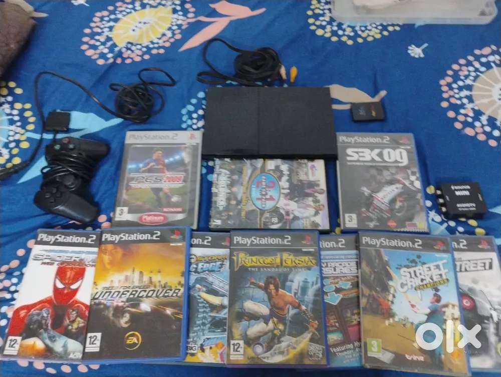 Ps2  slim console and 10 games(spiderman nfs etc)