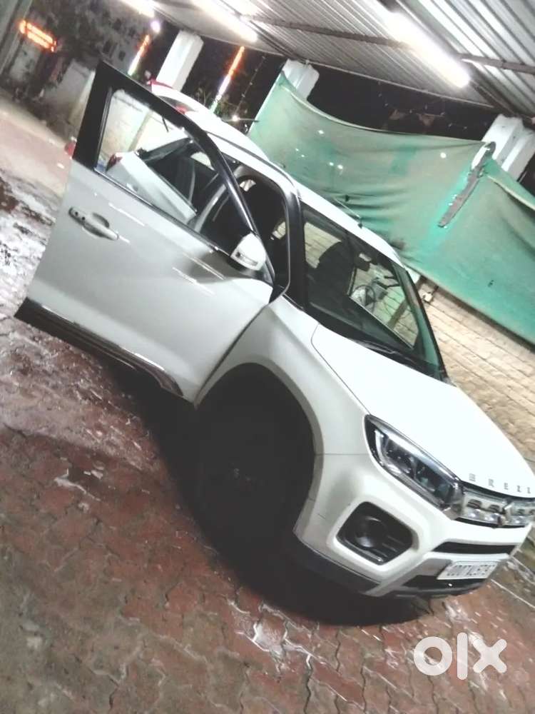 Brezza Zxi Car 18500 Km Driven Only