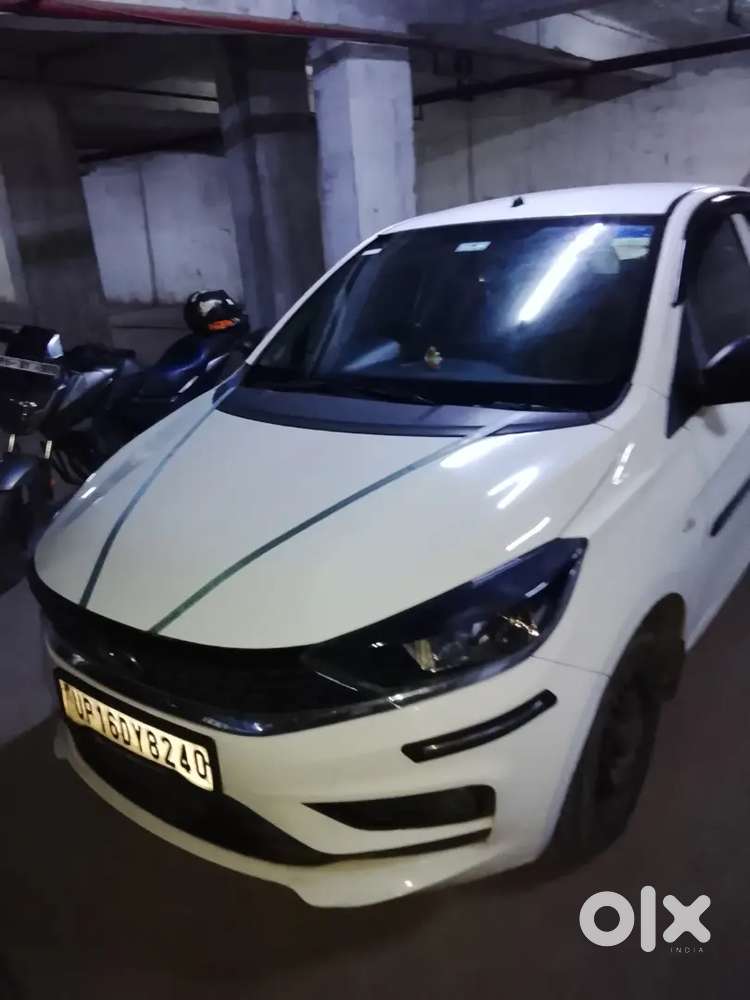 2023 October Tata Tata Tiago Xe (petrol) - White  21,000 Km