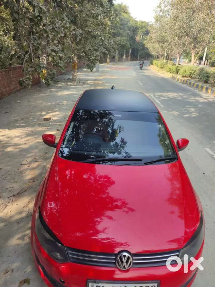 It's A Red Colour Polo With 17 Inchi Alloys