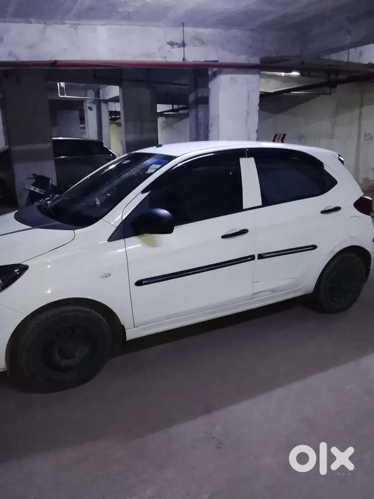 2023 October Tata Tata Tiago Xe (petrol) - White  21,000 Km
