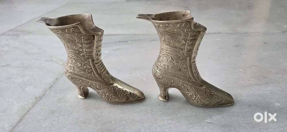 ornate brass high-heel boot-shaped showpieces