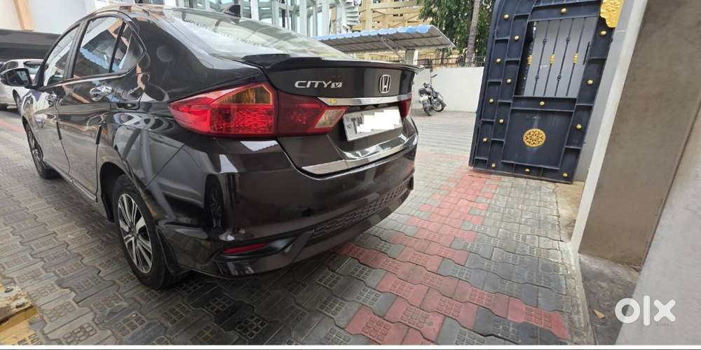 Honda New City V (petrol + Cng) Golden Brown