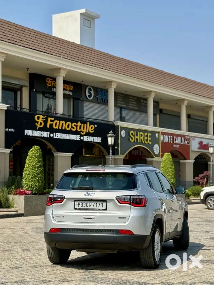 Jeep Compass 4x4 Next To Showroom