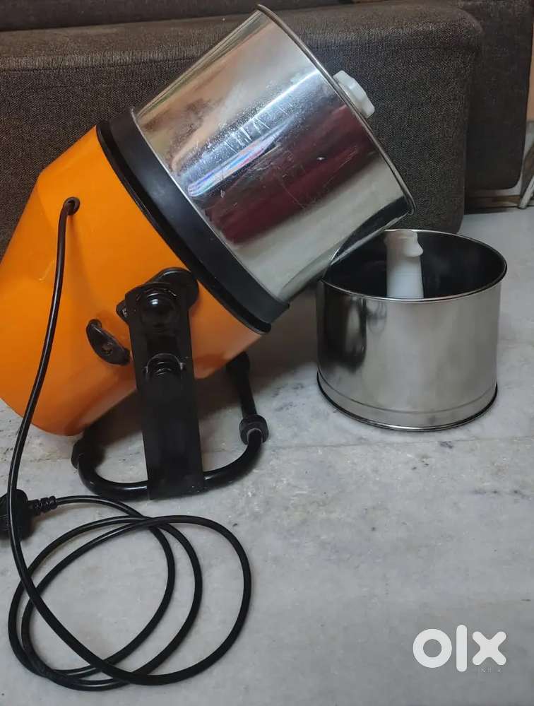 Titling wet grinder