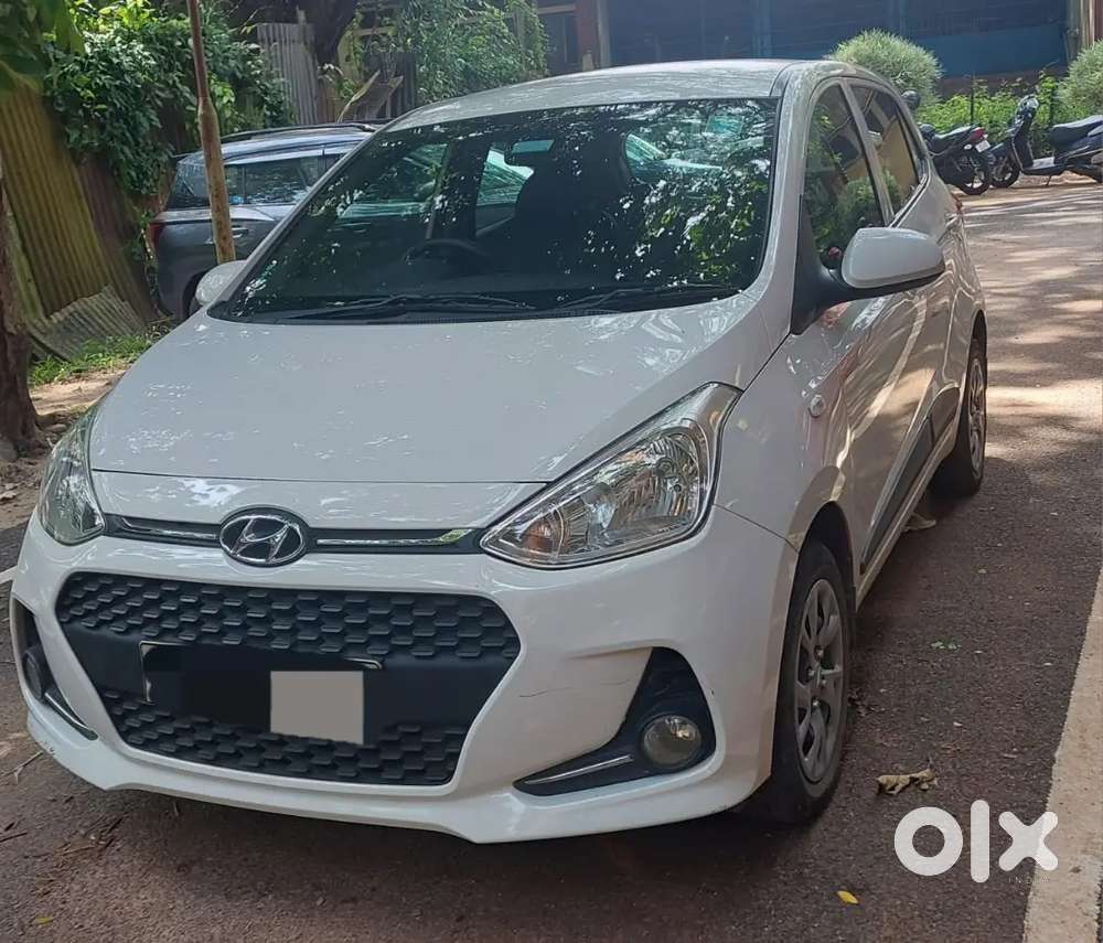 Hyundai Grand I10 2017 Petrol 47000 Km White Colour Single Owner