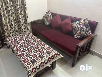 Old wooden deals sofa set olx