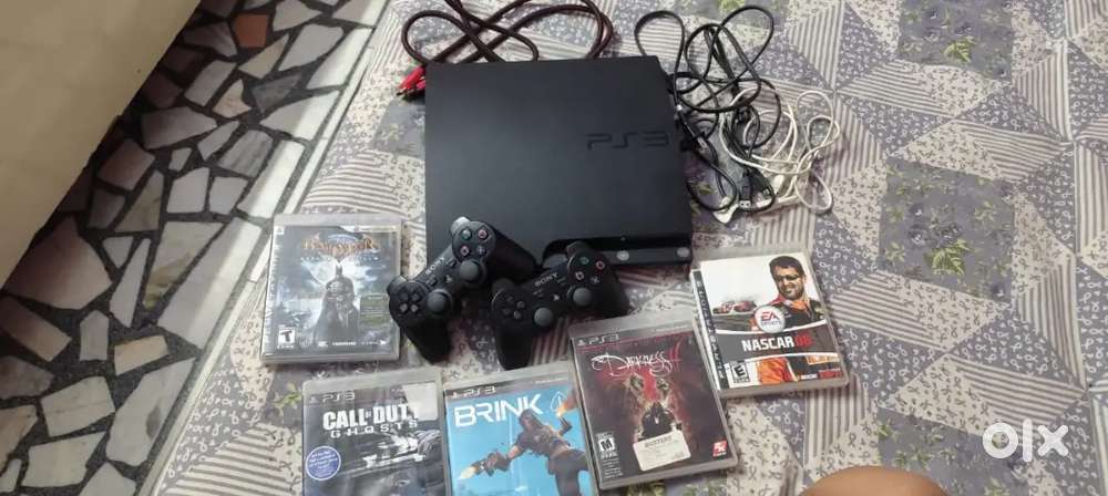 PS3 with original accessories as well as 5 games