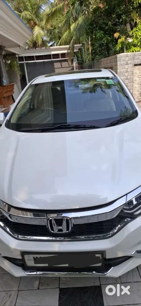 Low Km, Well Maintained And Sunroof Car