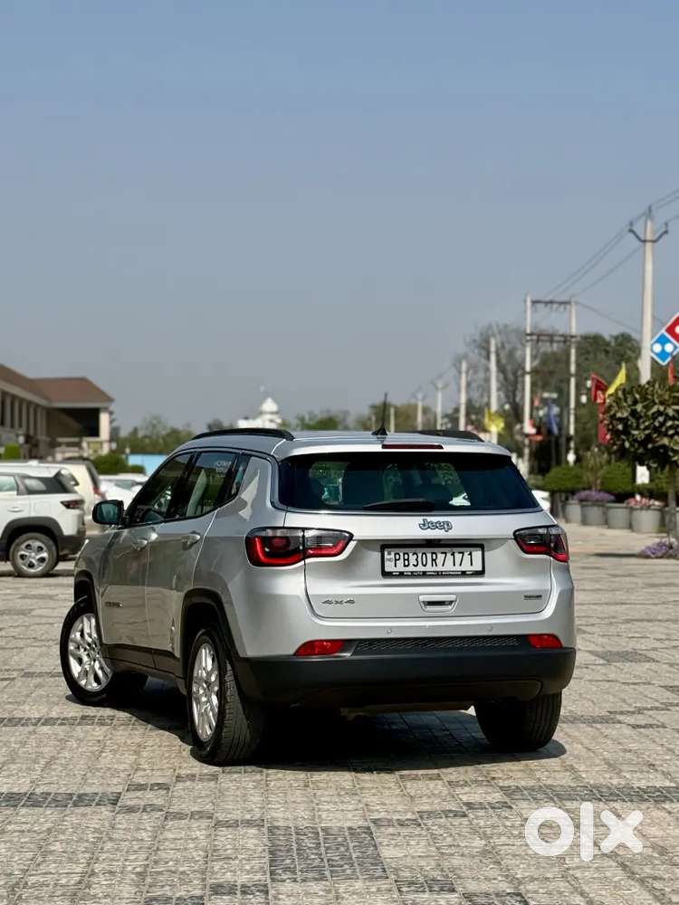 Jeep Compass 4x4 Next To Showroom