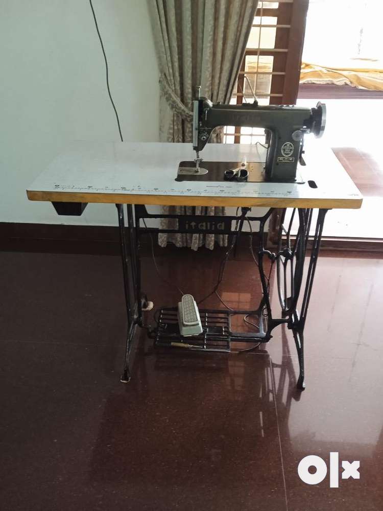 Tailoring machine with table price deals olx