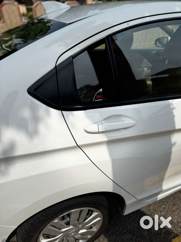 White Honda City - Officer Driven