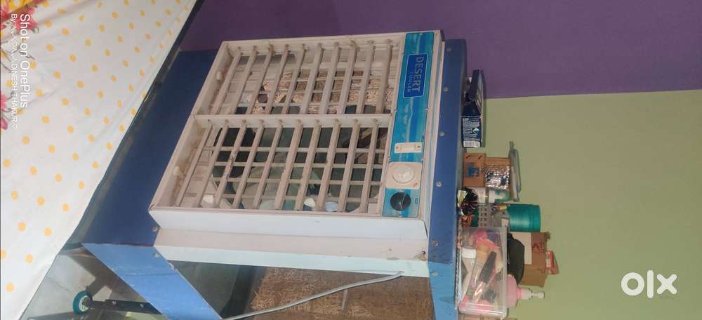 The item is a metal body desert cooler with blue and white panels