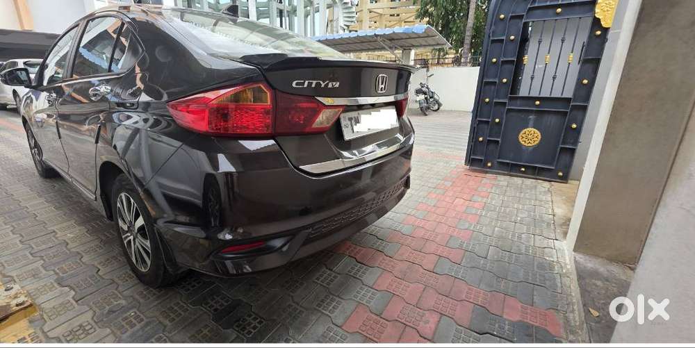Honda New City V (petrol + Cng) Golden Brown