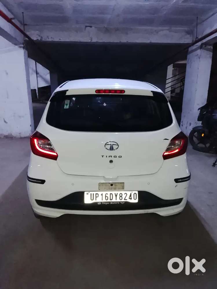 2023 October Tata Tata Tiago Xe (petrol) - White  21,000 Km