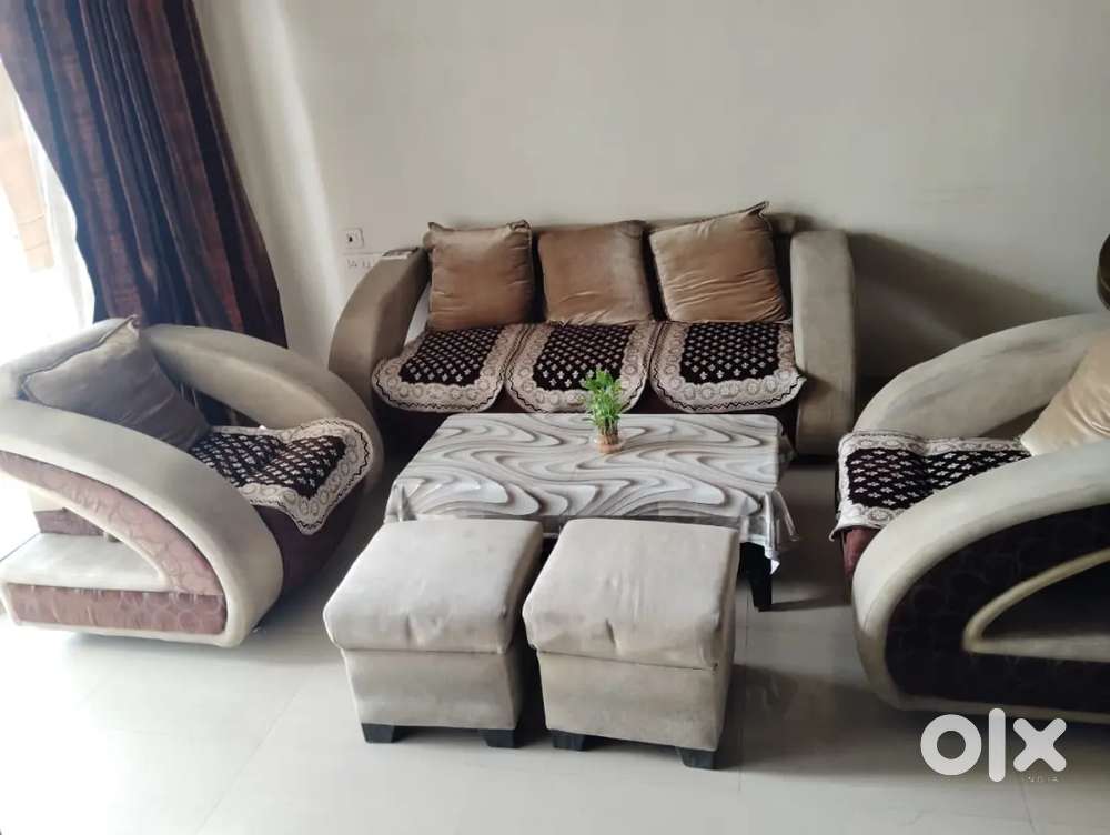 Cream and brown coloured sofa