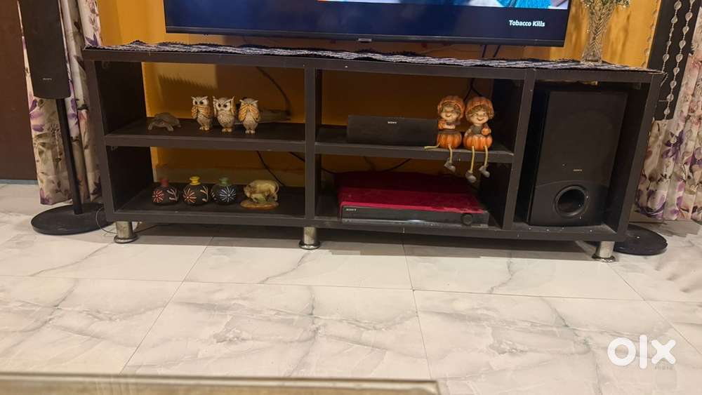 Its a lower tv table dark brown in colour.