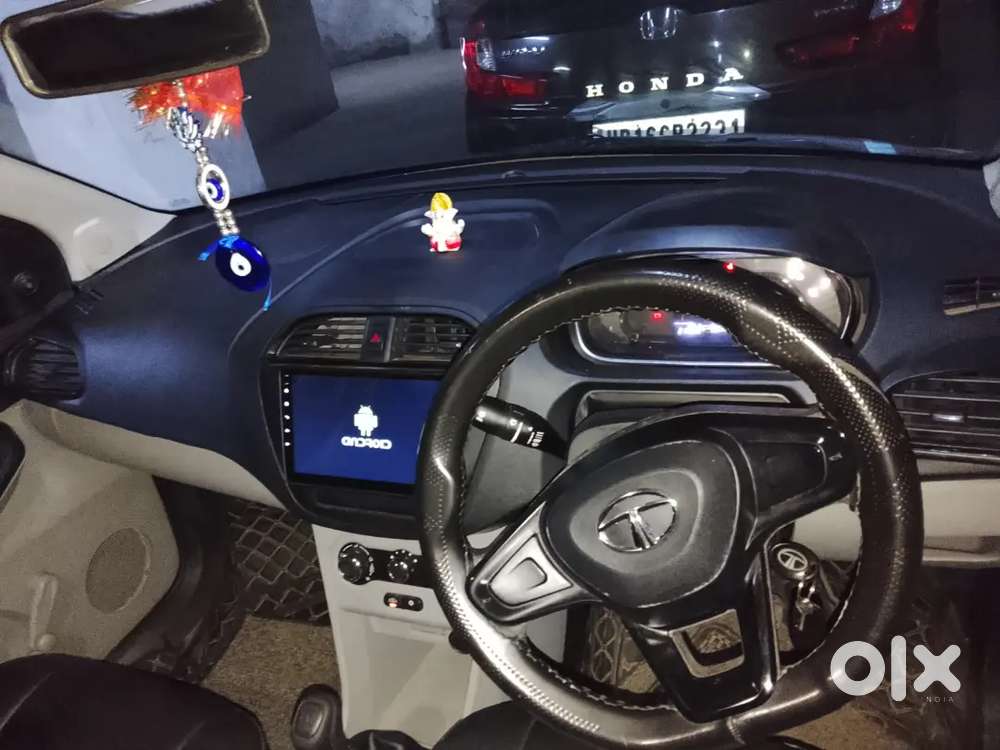 2023 October Tata Tata Tiago Xe (petrol) - White  21,000 Km