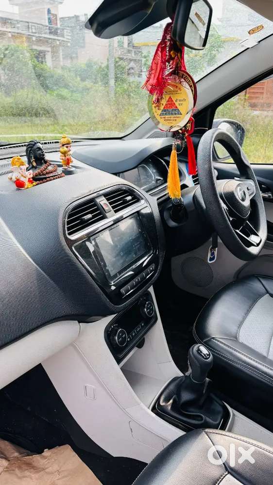 This Is The Top Model Tata Tiago  It's A New Car Driveen Only 9000 Km