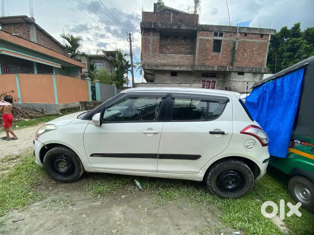 Maruti Suzuki Swift Lxi 2014