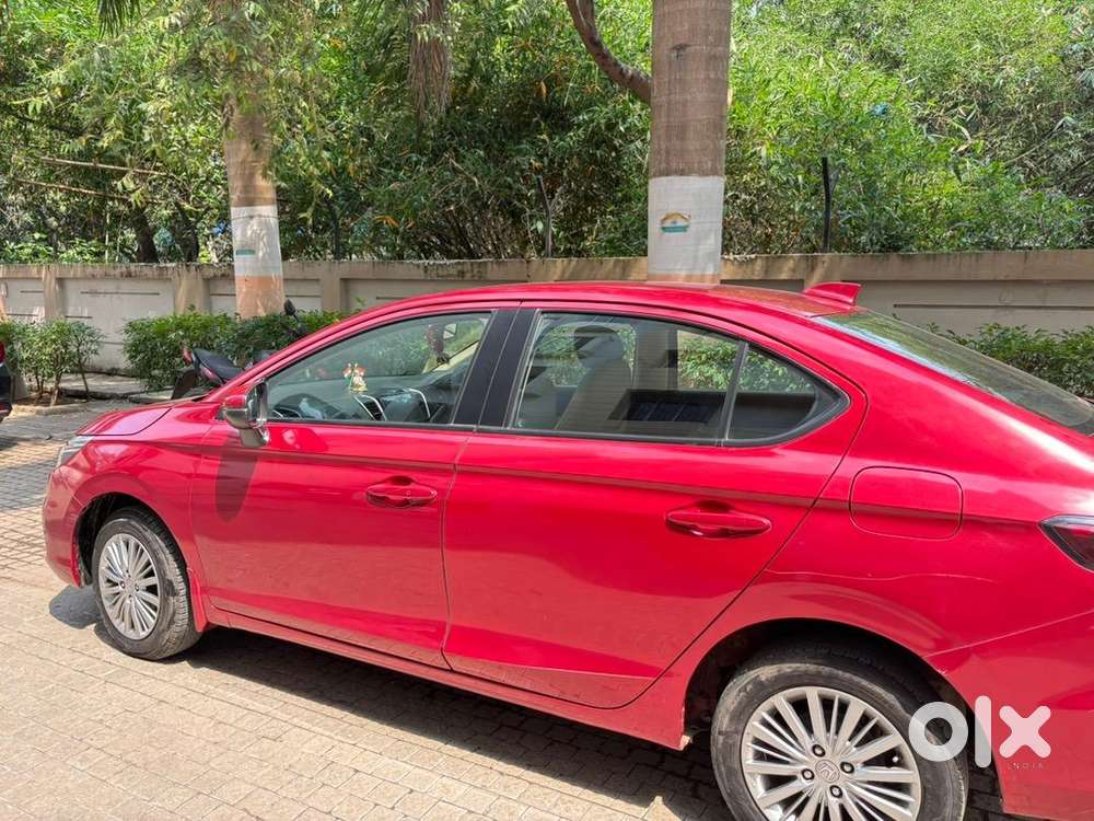 5th Generation Red Colour Honda City V Model Driven By A Ca