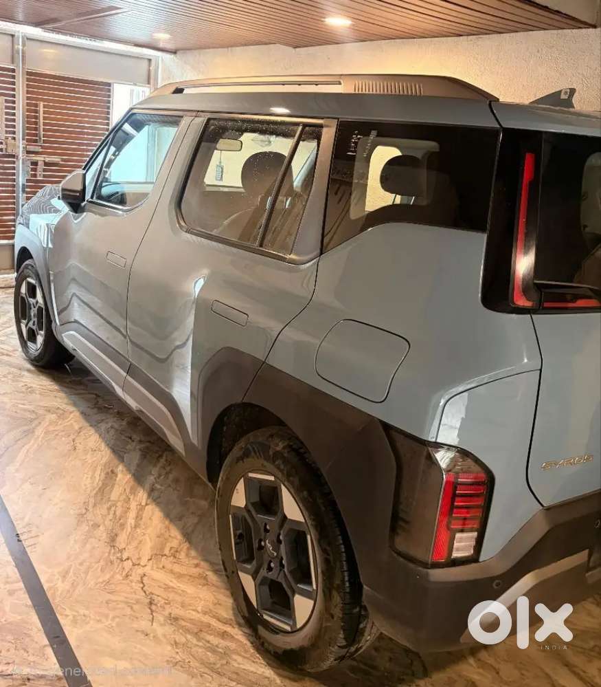 Kia Syros 2025 Next To Showroom