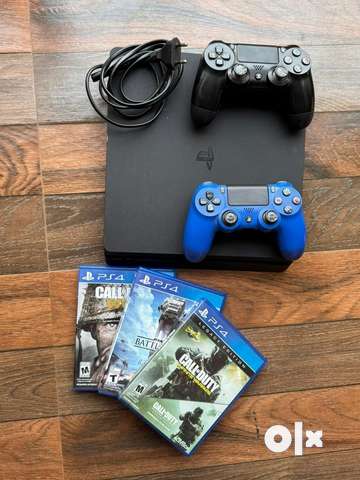 PS4 with store 2 controllers and 3 games