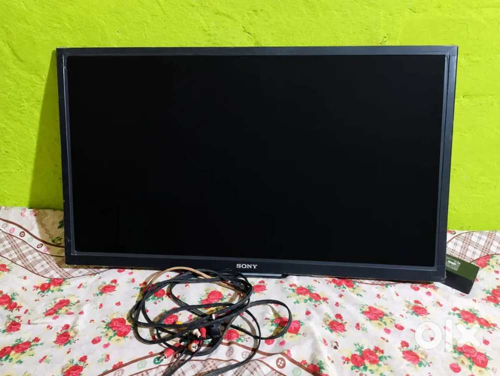 Sony 32-inch LED Bravia television with bundled cables.