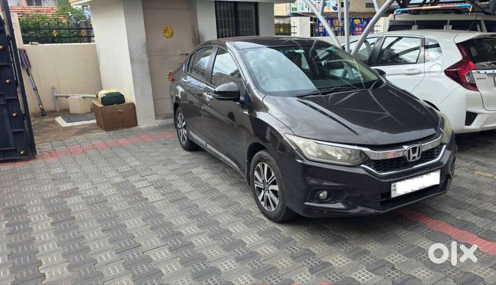 Honda New City V (petrol + Cng) Golden Brown