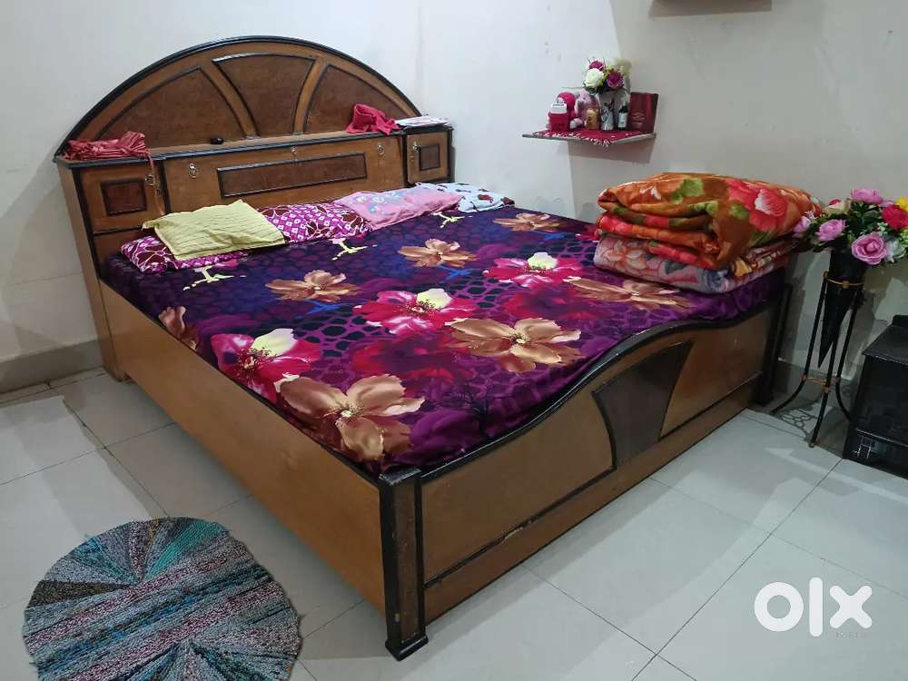 Well furnished wooden bed