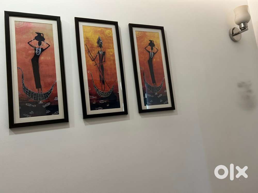 Three wall painting purchase from Homecenter and two wall clock