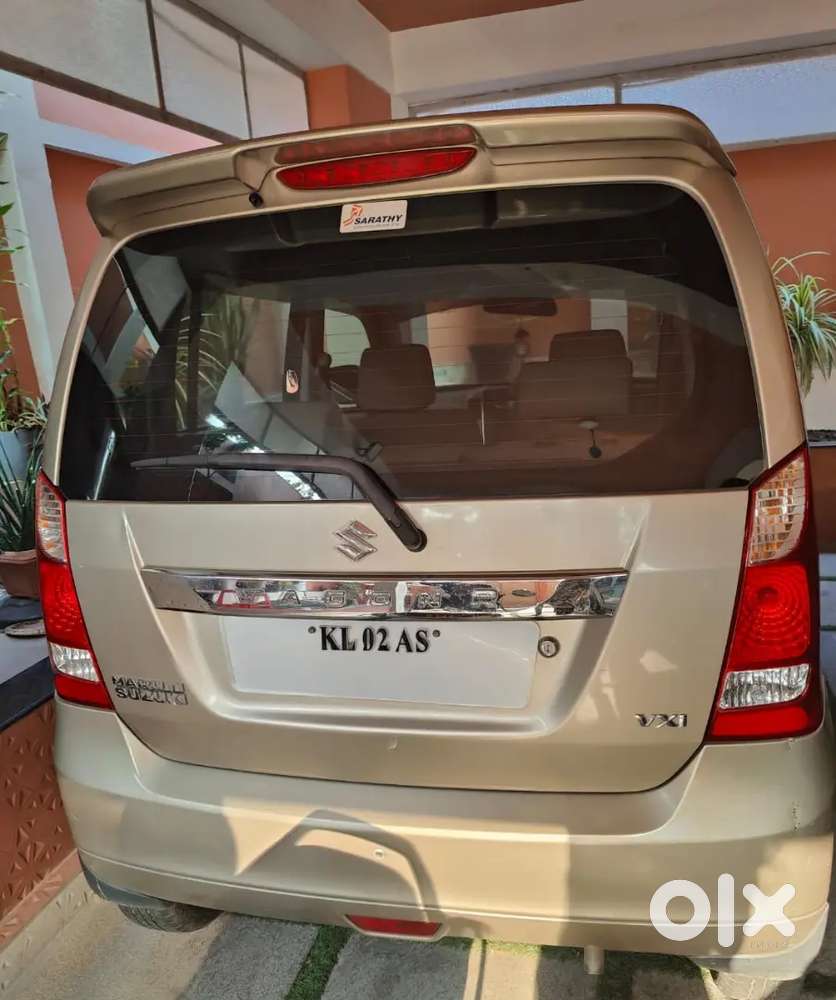 Wagon R Vxi Low Km Fancy Number Single Owner Golden Colour