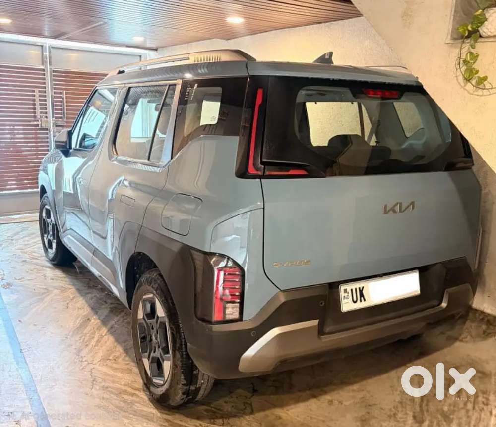 Kia Syros 2025 Next To Showroom