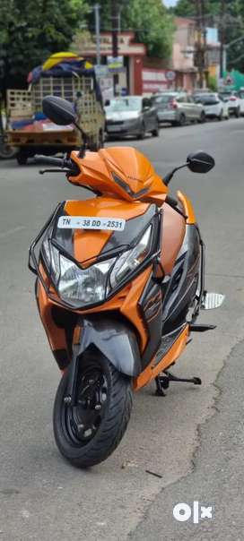 Dio scooty orange colour price hotsell