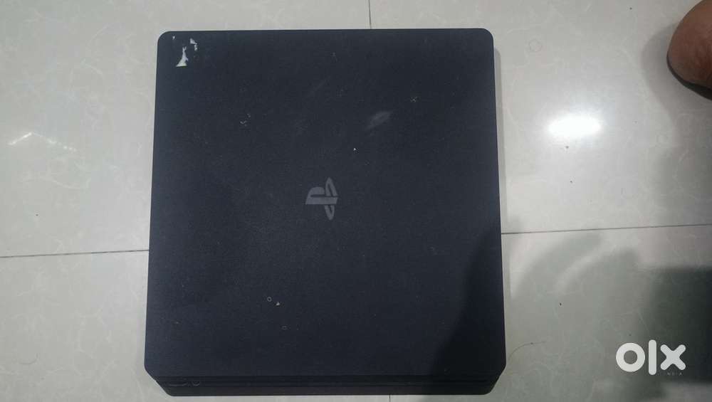 PS4 slim 1.5 years old in excellent condition  original controller