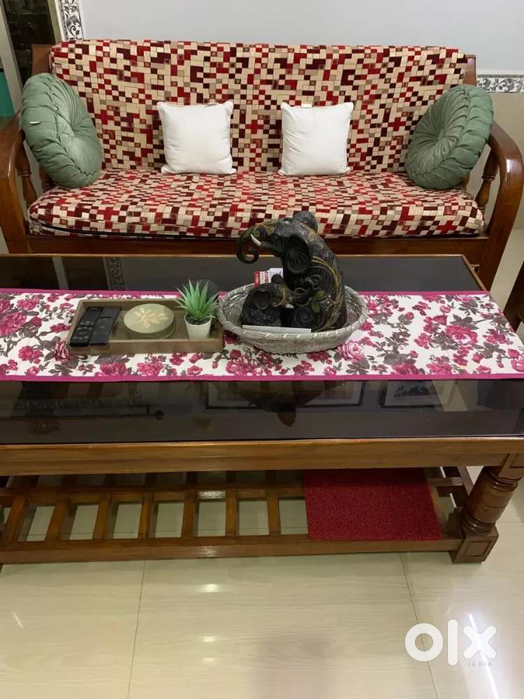 Teak wood sofa set with a matching wooden & glass centre tablle