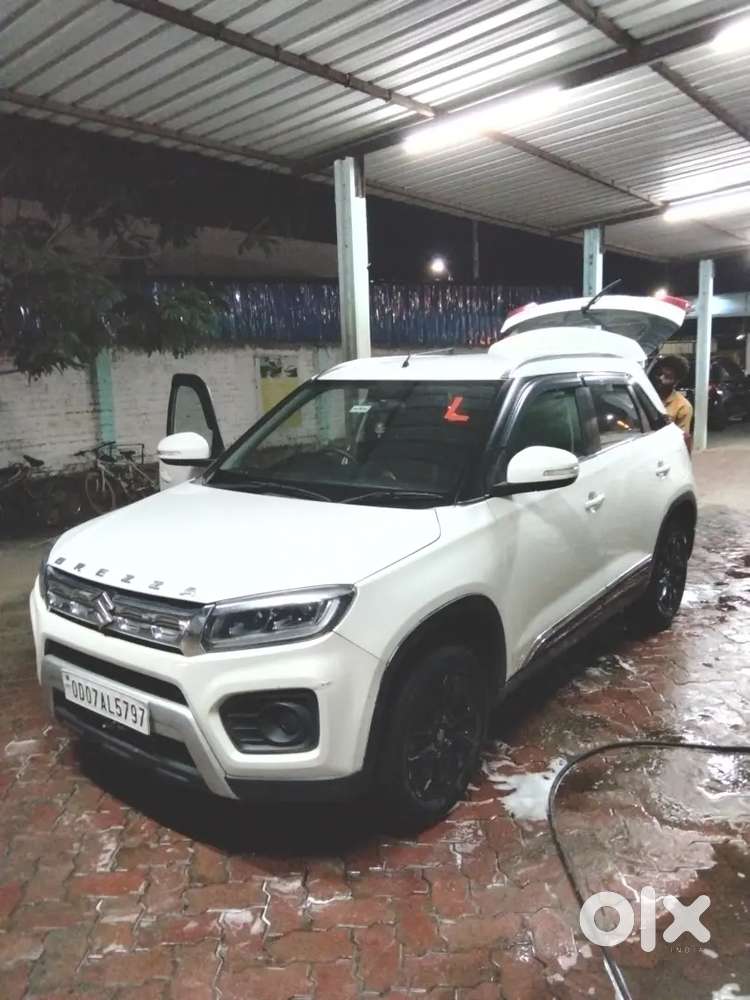 Brezza Zxi Car 18500 Km Driven Only