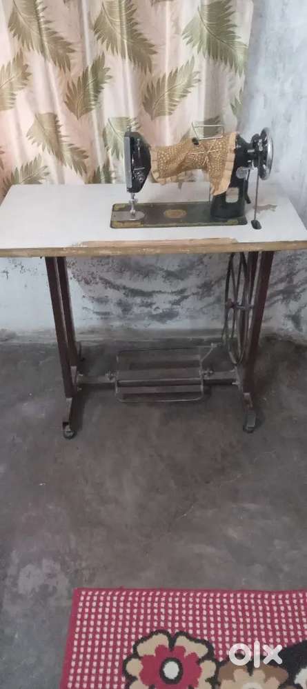 Sewing machine with table